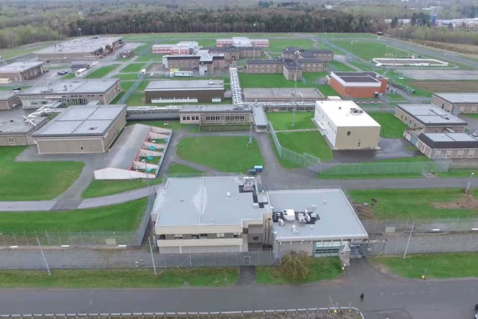 Aerial view of the Donnacona Correctional Complex, showing secure buildings, perimeter fences, and outdoor facilities on a large green property
