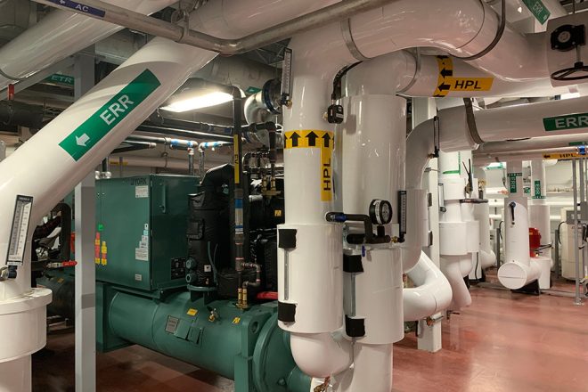 Industrial mechanical room with HPL and ERR-labeled piping, York refrigeration system, and control equipment at the Parmalat plant in Victoriaville