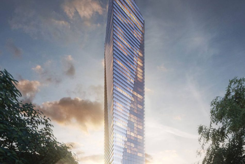 Dusk view of Victoria sur le Parc Tower in Montreal, showcasing its sleek glass architecture and distinctive triangular silhouette in the downtown core